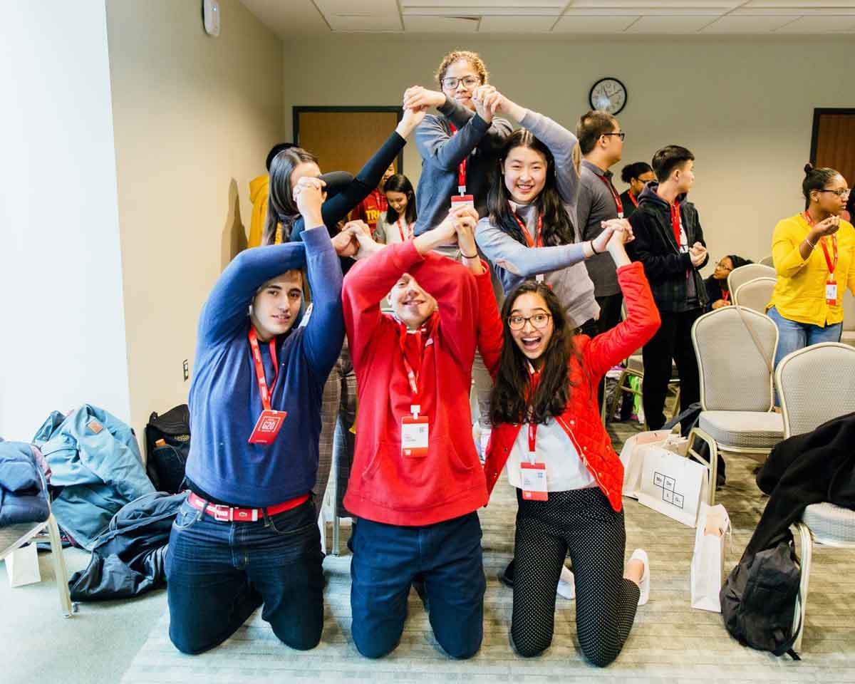 Students posing for a photo at the Model G20, a global blended learning event for high school students